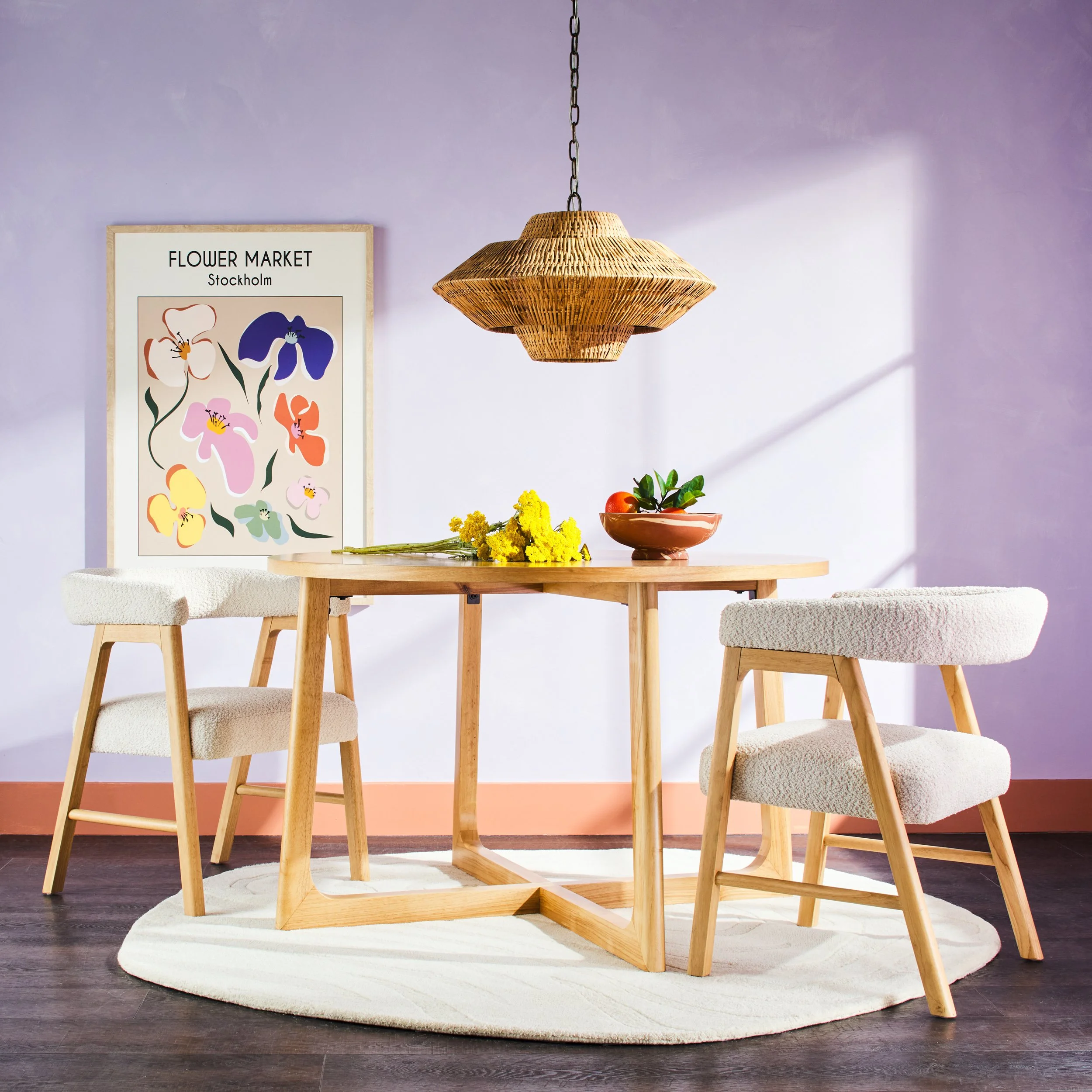 Walker Edison white dining table and chairs in lavender-walled room with rattan pendant and botanical art — lifestyle furniture photography by BK Captured