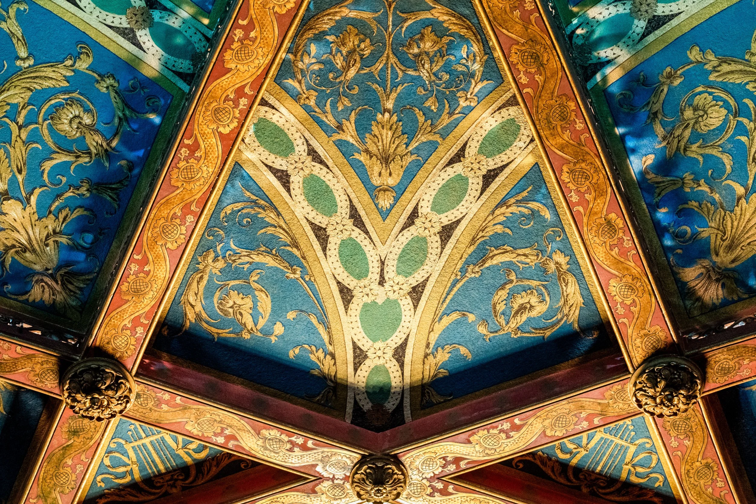 Geometric hand painted ceiling detail in historic Warnor theater — architectural photography by BK Captured