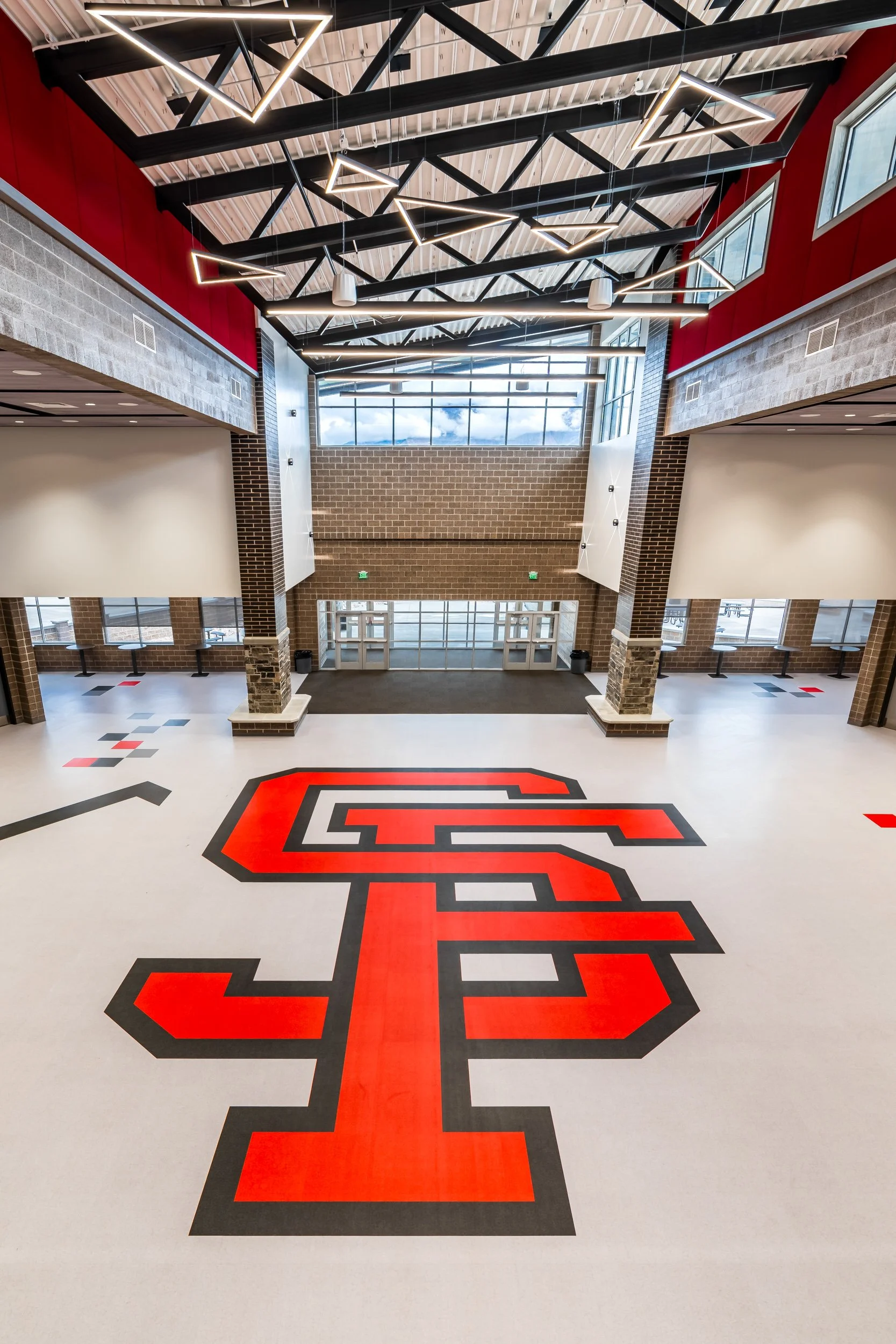 Spanish Fork High School logo painted on cafeteria floor — educational facility detail photography by BK Captured