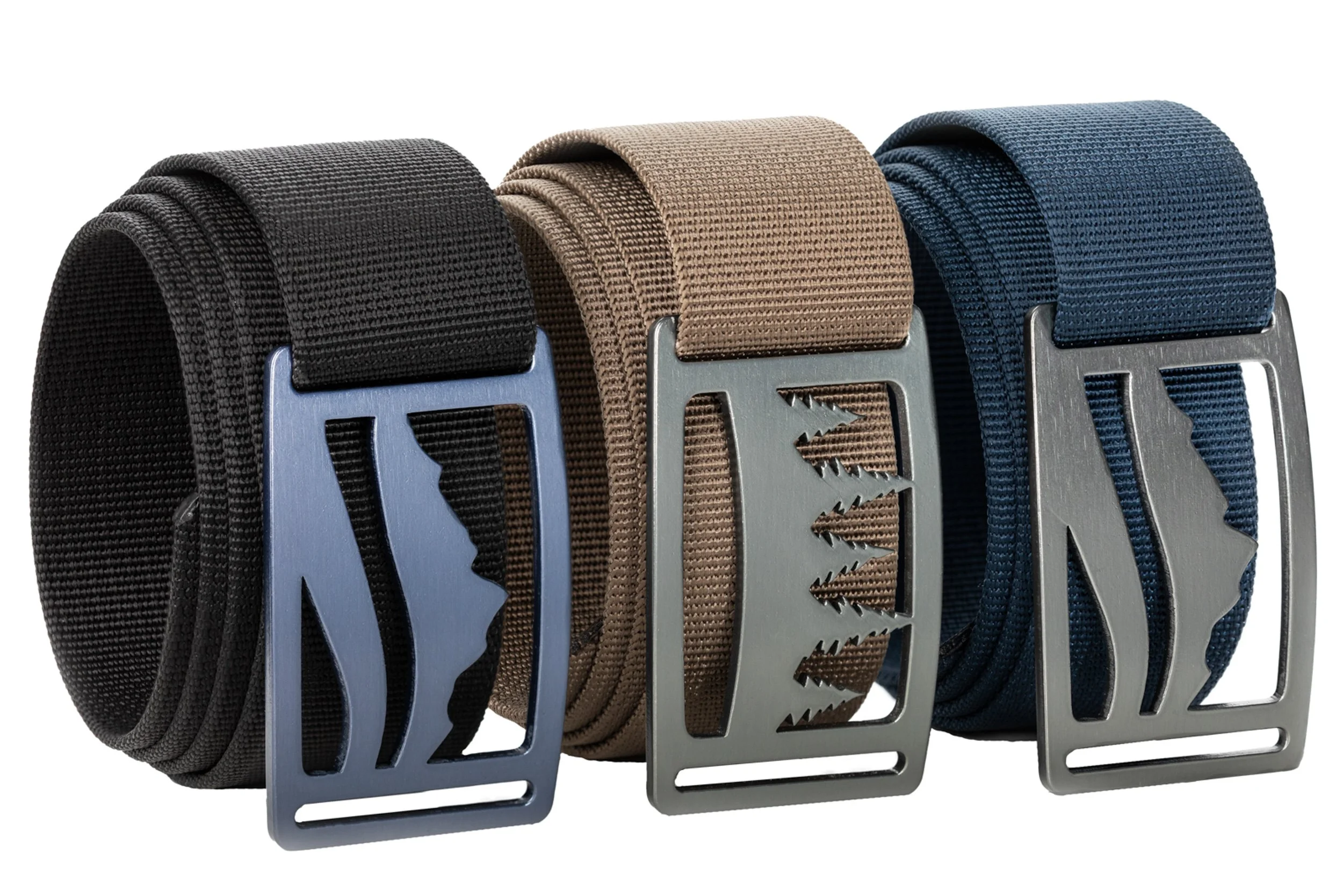 Grip6 belts in black, tan, and blue patterned styles with buckles on white background — product photography by BK Captured