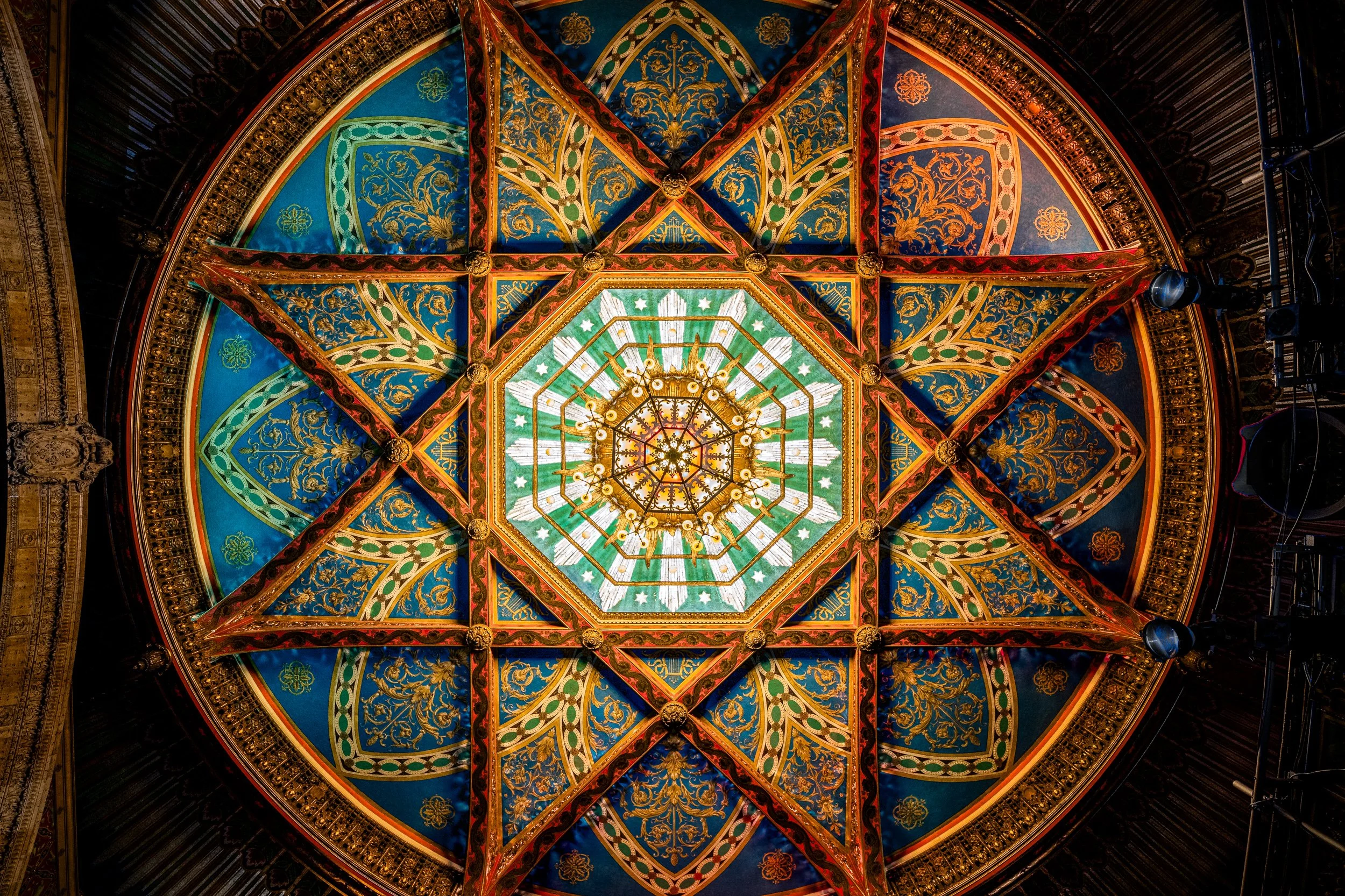 Wide view of historic theater painted ceiling dome with ornate gold and blue medallion — architectural detail photography by BK Captured
