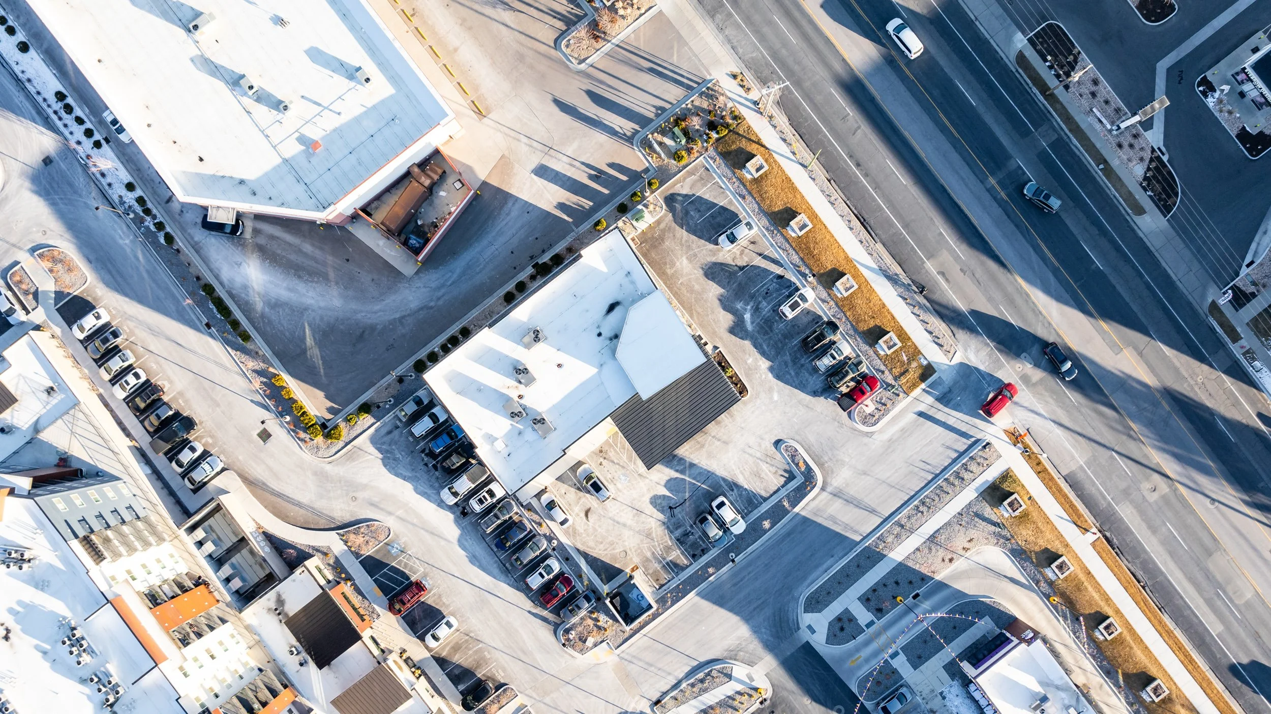 Overhead aerial view of building rooftop showing geometric form and massing — architectural photography by BK Captured