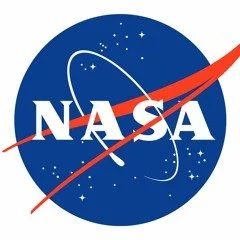 NASA logo featuring a blue circle with white stars, a red swoosh, and the white letters 'NASA' in the center.