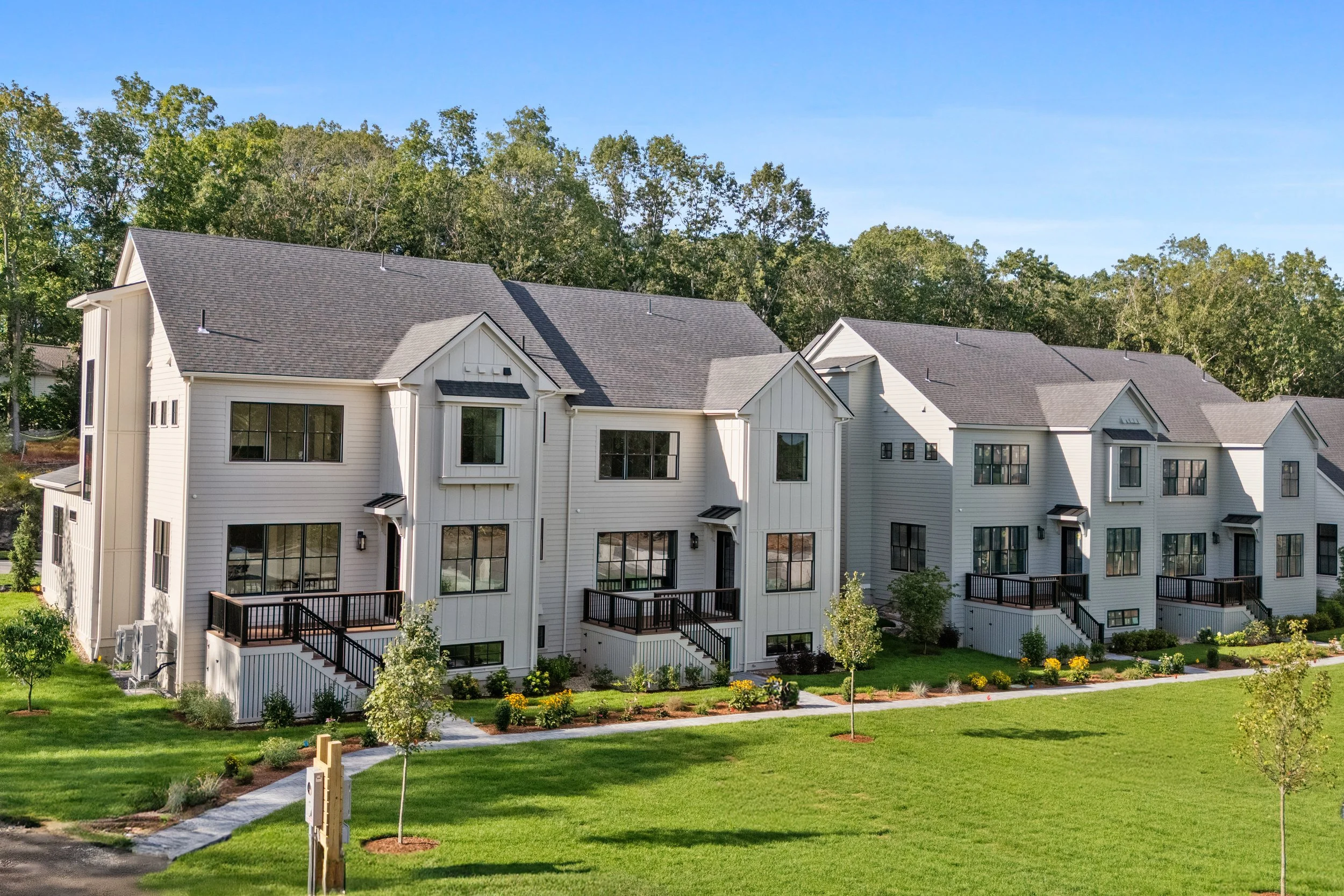 Rear view of decks and common greenbelt at Fairland Commons, Lexington MA