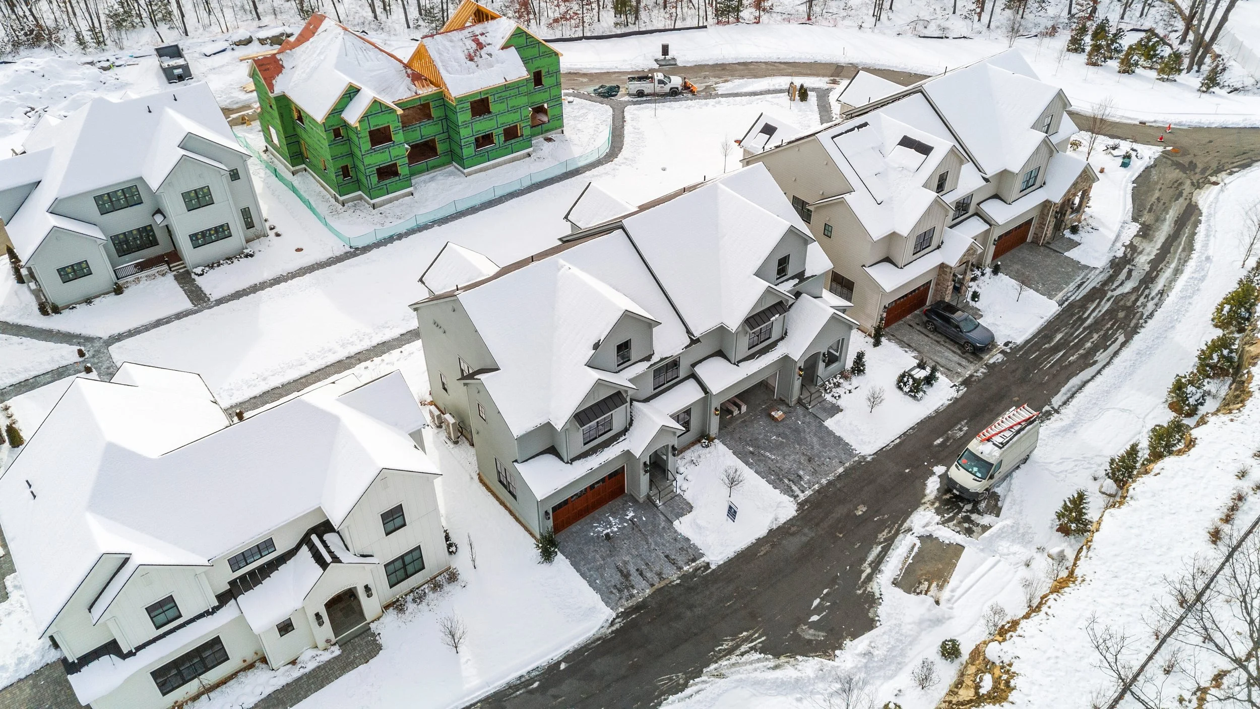 Winter aerial of 18 Common Court, Lexington MA blanketed in snow 