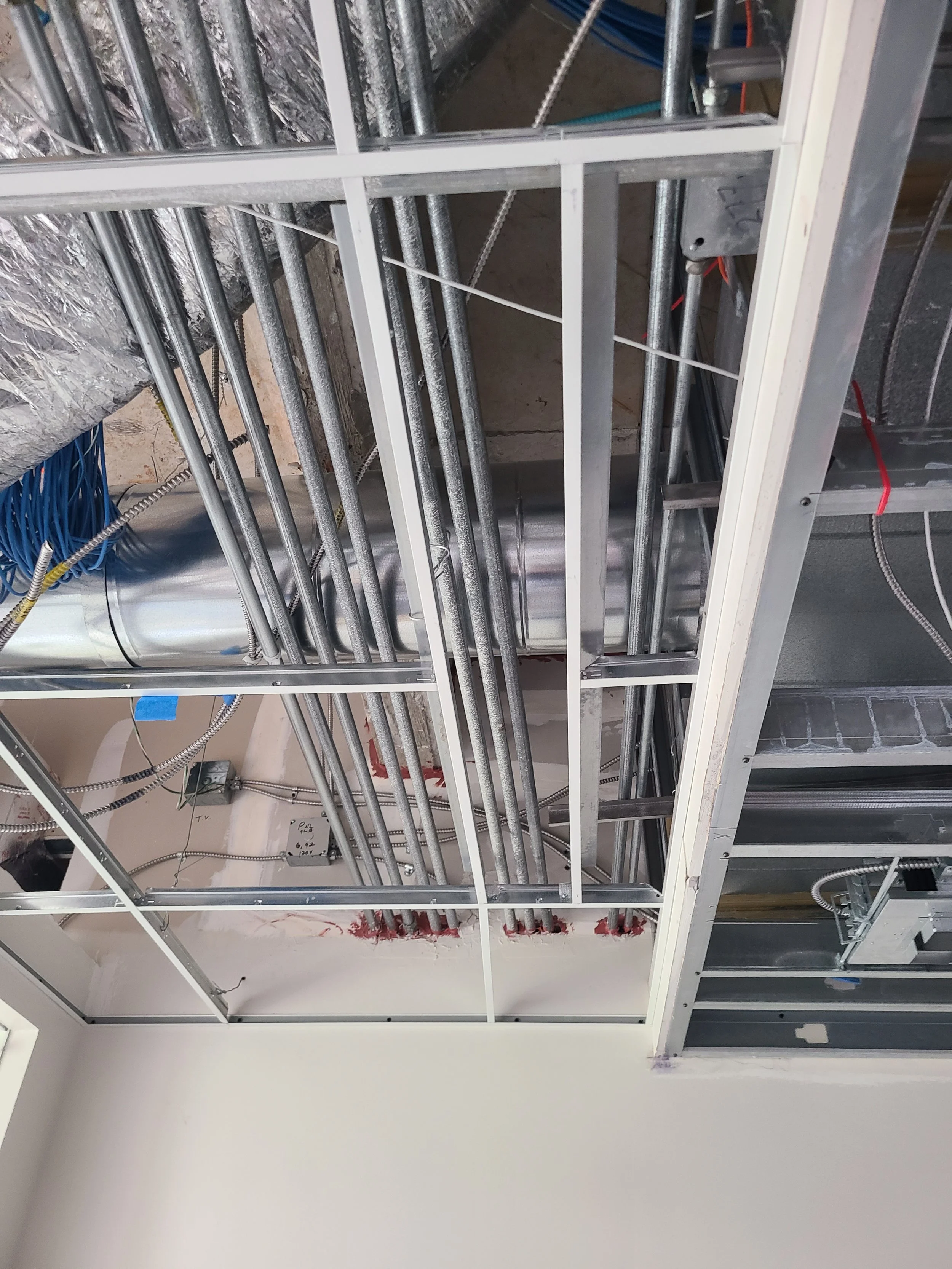 fire protection at penetrations and ceiling gris installation