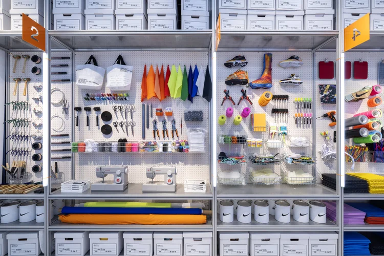 Workshop station with paint and supplies on pegboards