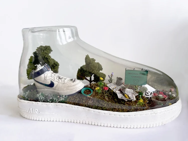 Miniature Original Rose Garden landscape built inside a clear Nike sneaker