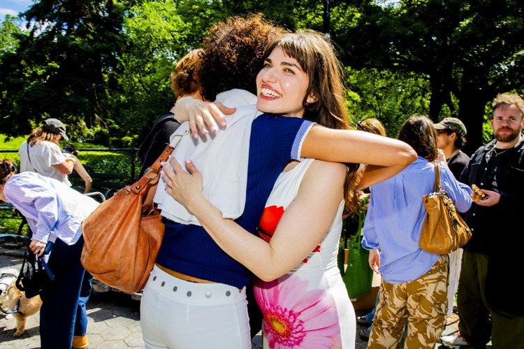 Attendees greeting each other at the Tompkins Square Park walk