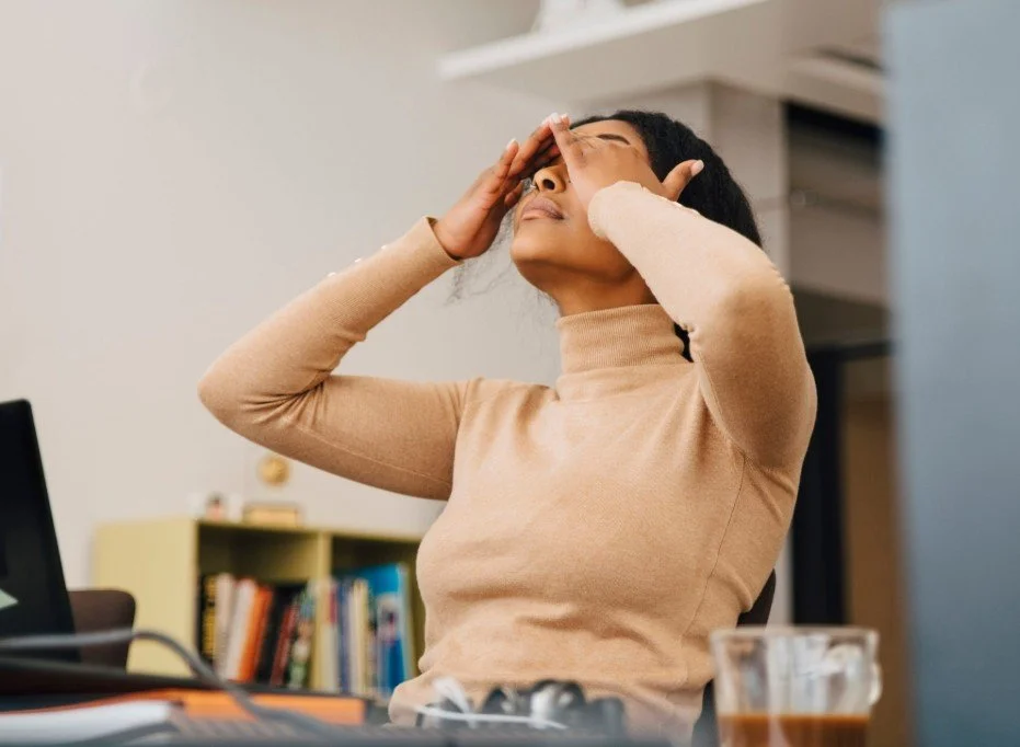 Frustrated and tired woman at work
