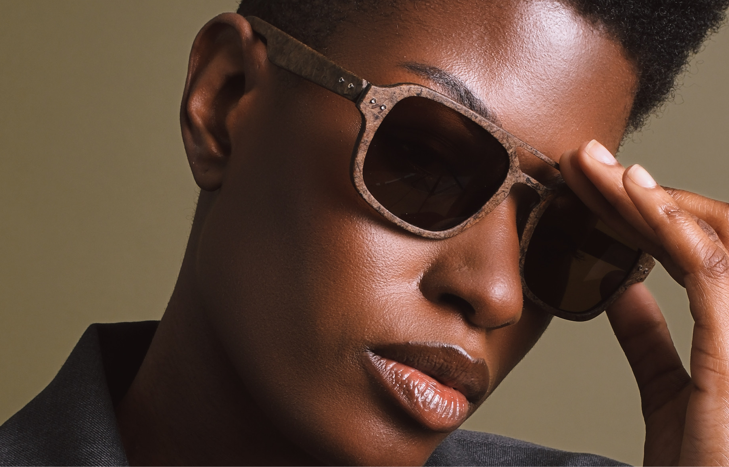 An image of a Black woman wearing Hemp Eyewear frames