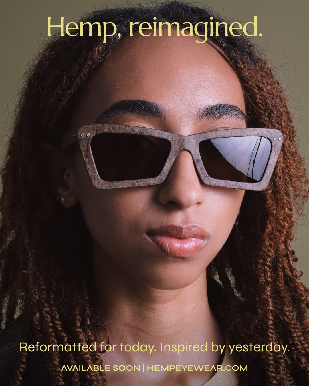 A woman wearing stylish sunglasses made from hemp, with text overlay promoting reimagined hemp products and a website.