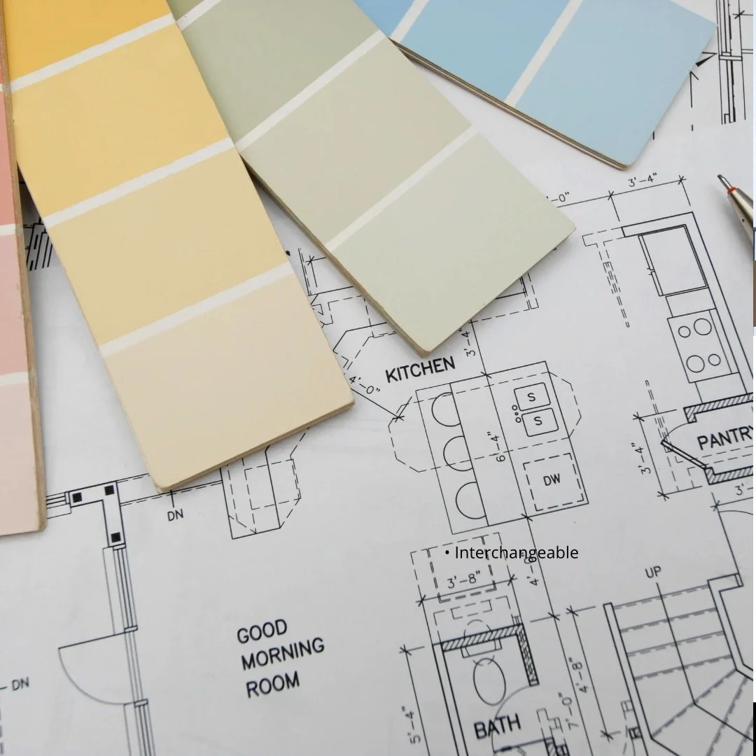 Kitchen and bath design process with floor plans and material samples laid out for project planning.