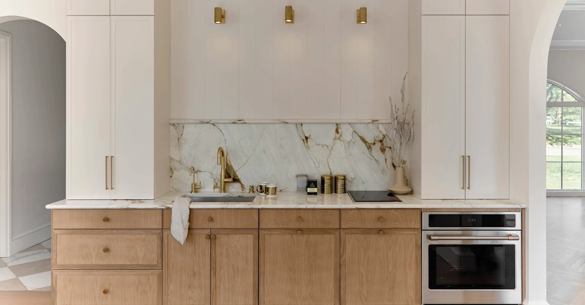Custom kitchen cabinets with quartz countertops and modern island design in New Hampshire home.