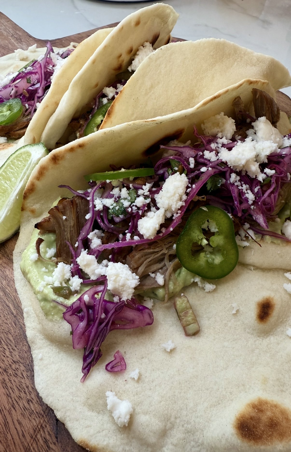 Mojo Pork Tacos on a Duck Fat Tortilla with Cilantro Lime Slaw and Avocado Crema
