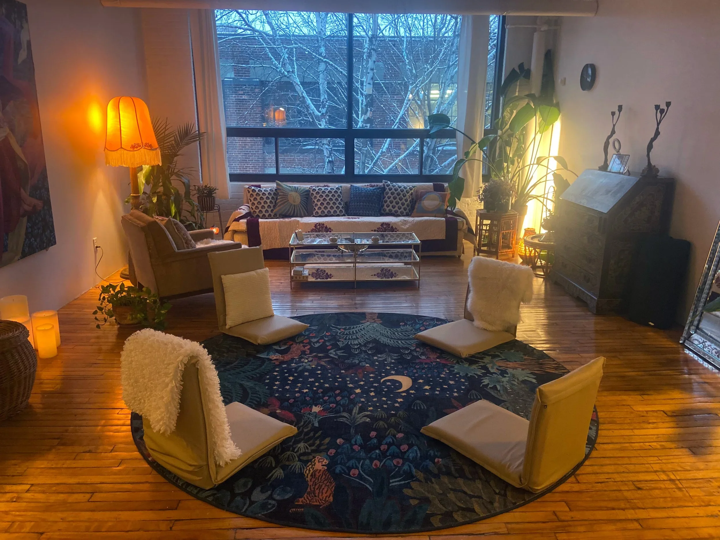 Cozy St-Henri Montreal therapy and ceremony space with warm lighting and winter garden view