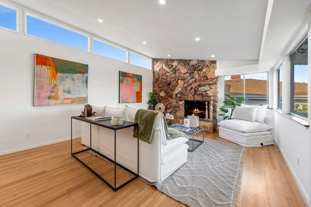 An exterior image of a two-story home with a green hue. 