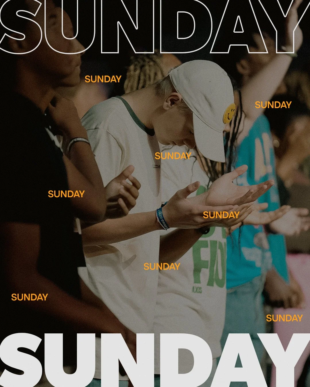 A group of people standing closely together, each with their hands open and holding a small object, likely in prayer or reflection, during a religious or spiritual gathering on a Sunday.