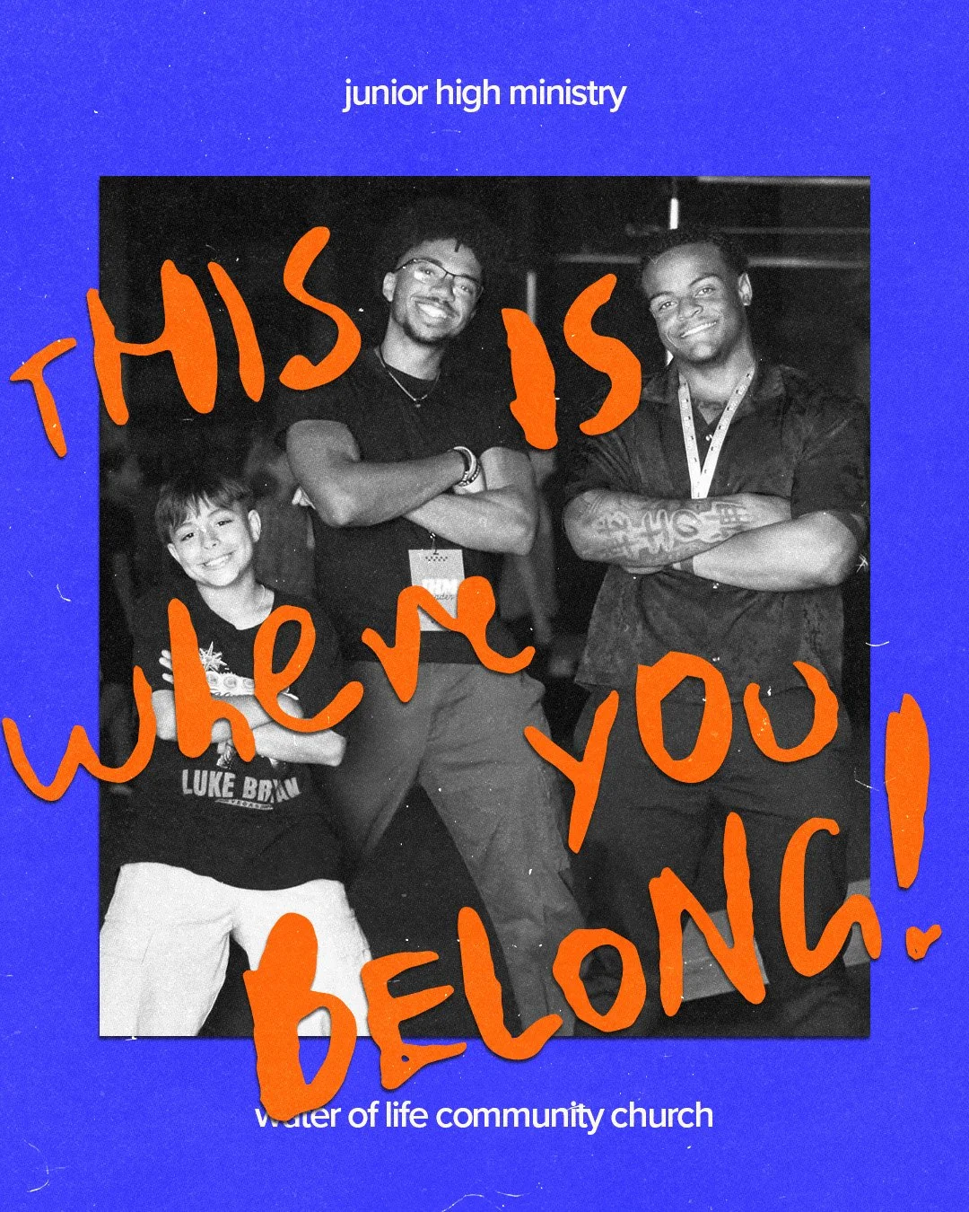 Black and white photo of three people, two men and one boy, smiling with crossed arms. There is large orange handwritten text overlaying the photo that says, 'This is when you belong!' The background text states 'junior high ministry' and 'water of l