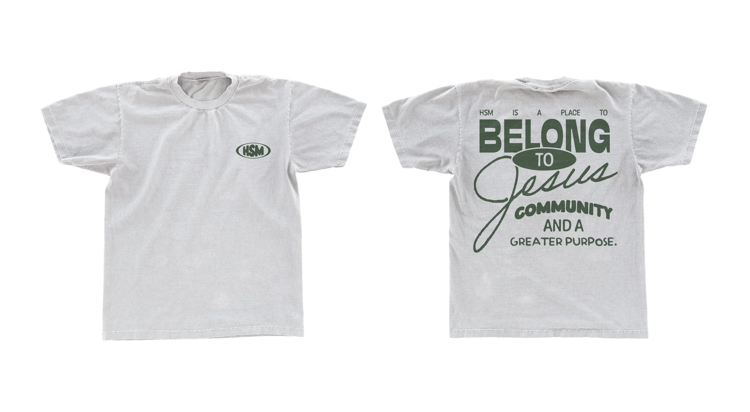 White T-shirt with green logo and text, featuring the phrase "HSM" on the front chest and a larger message on the back that reads "HSM is a place to belong to Jesus, community, and a greater purpose."