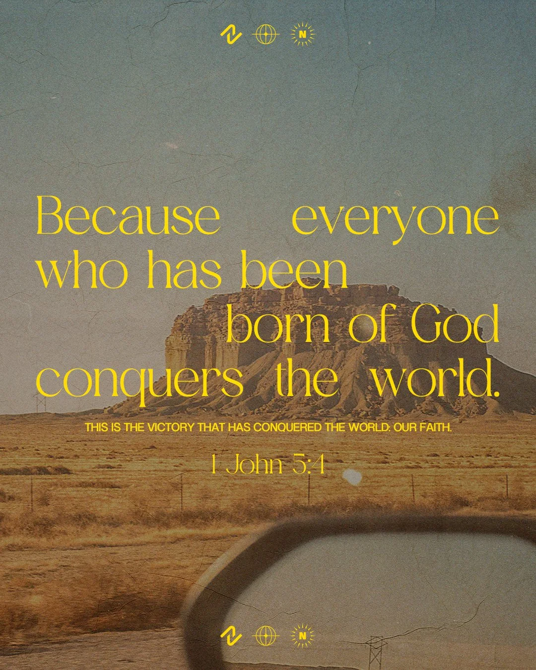 A landscape with mountains and a desert, overlaid with a biblical quote from 1 John 5:4 in yellow text, reading: "Because everyone who has been born of God conquers the world."