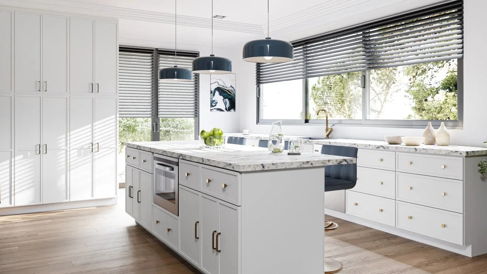Modern kitchen with white cabinets, marble countertop, large window, and wooden floor. There are three black pendant lights and a small island with a bowl of green apples, glass pitcher, and glasses. A potted plant is in the corner, and there's a col