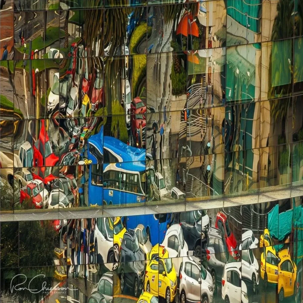 Reflections of rush hour traffic in the windows of an office building. ©Ron Chiasson Photography @rsonphoto.