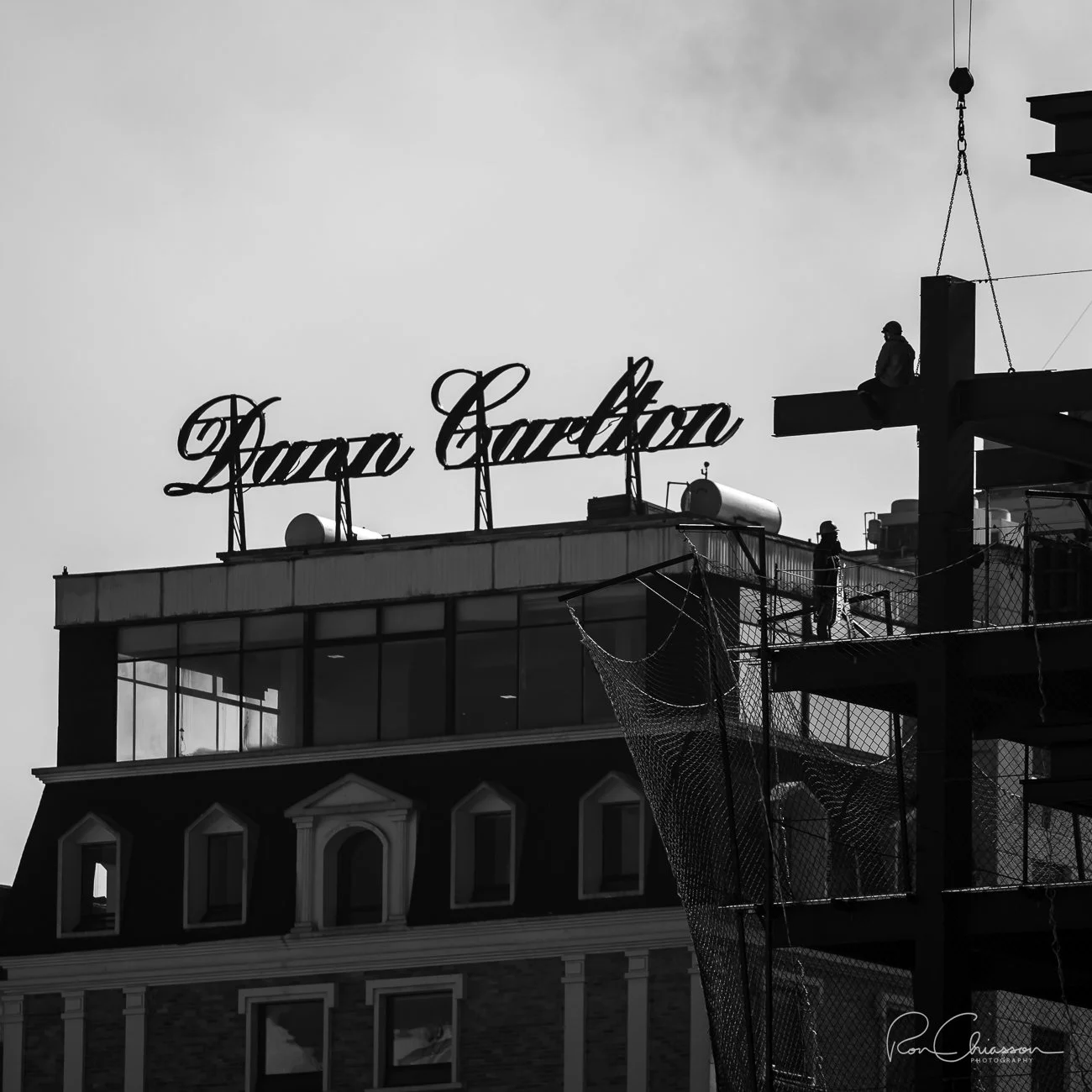 Quitos Dan Carlton luxury hotel in line with a worker on a beam during construction of the Westinghouse Project in Quito. ©Ron Chiasson Photography @rsonphoto.