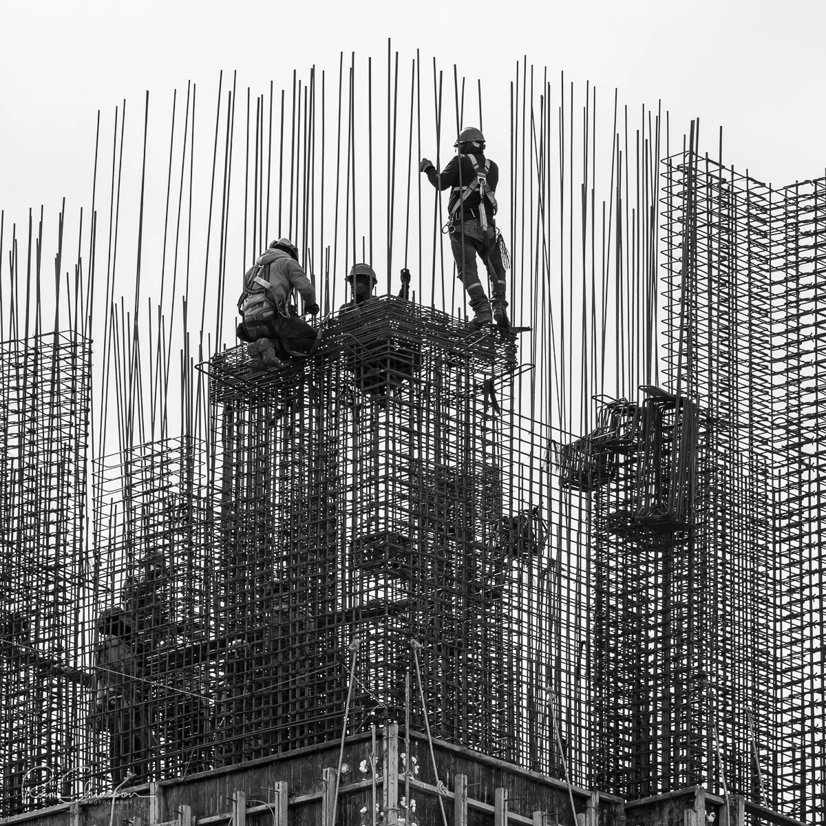 Ironworkers tying rebar. Construction of the Westinghouse Project, Quito. ©Ron Chiasson Photography @rsonphoto.