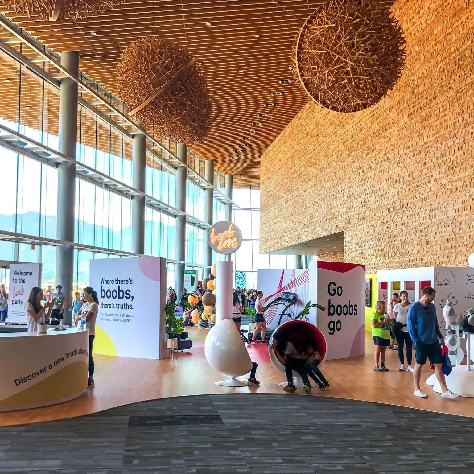 lululemon 'boob truths' campaign at the Vancouver convention centre, a modern interior featuring a retail pop up and sports bra testing experience.