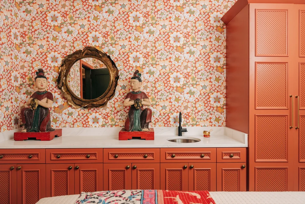 Bold red floral wallpaper installation