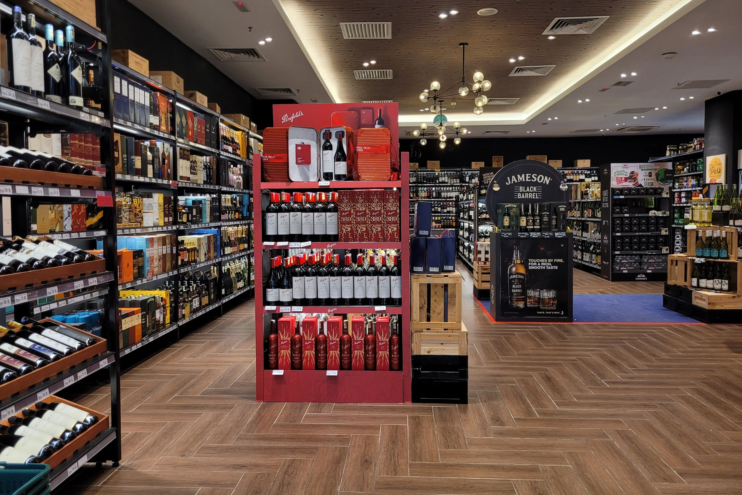 Retail environment featuring branded displays, packaging, and in-store marketing materials.