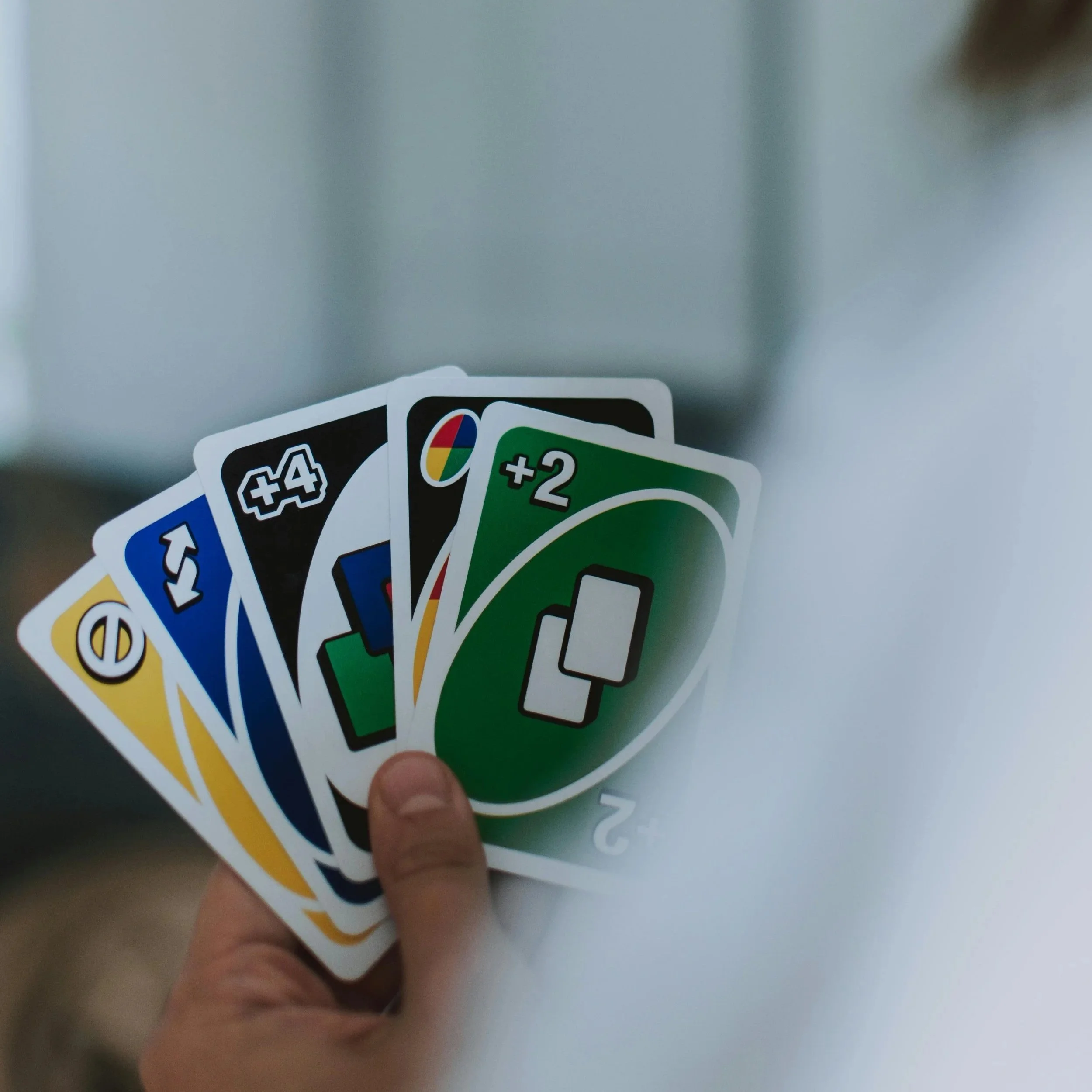 A child holding up a card game