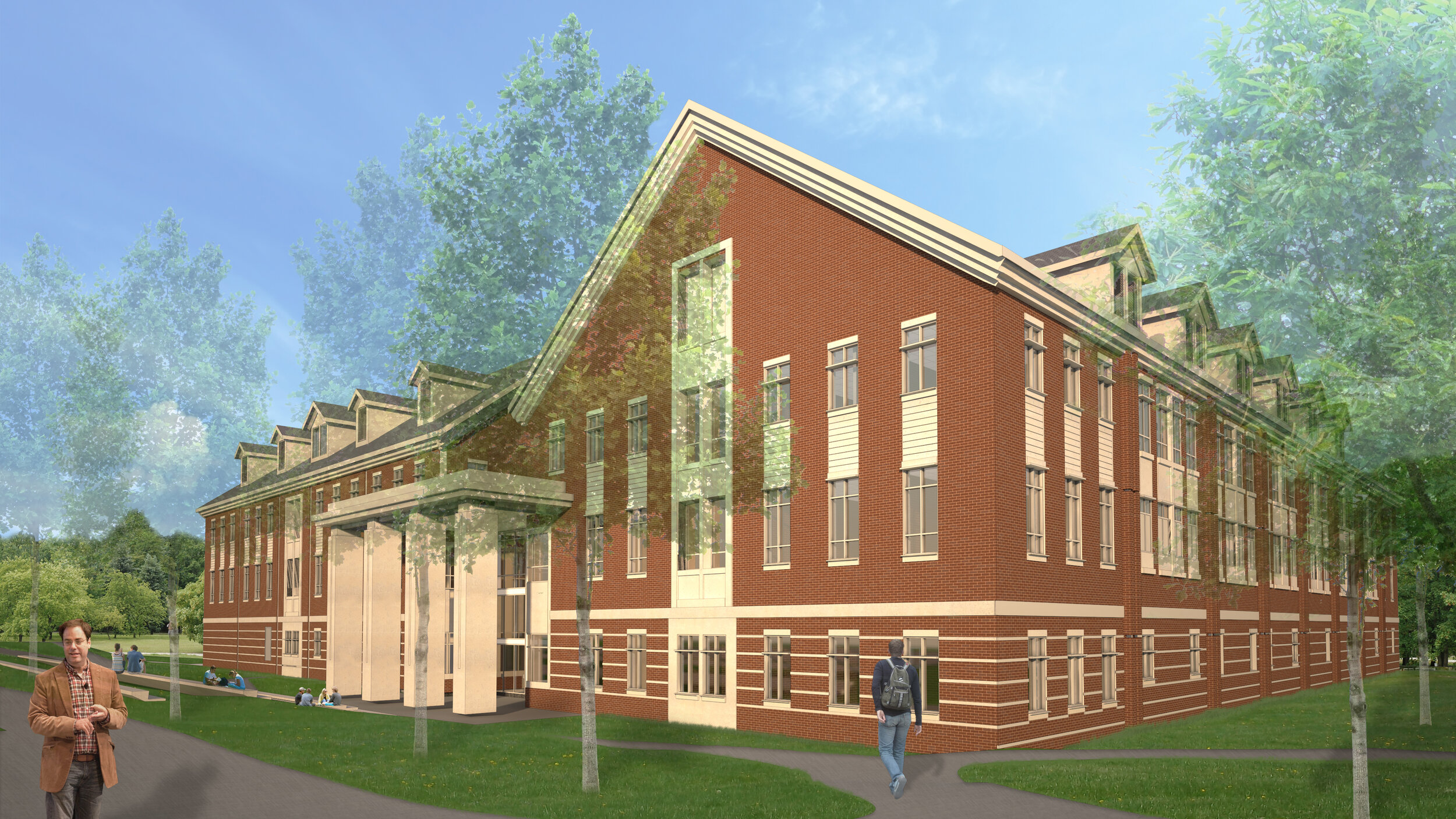 A large red brick building with multiple windows and a sloped roof surrounded by green trees and a well-maintained lawn. People are walking and sitting on benches outside on a sunny day.