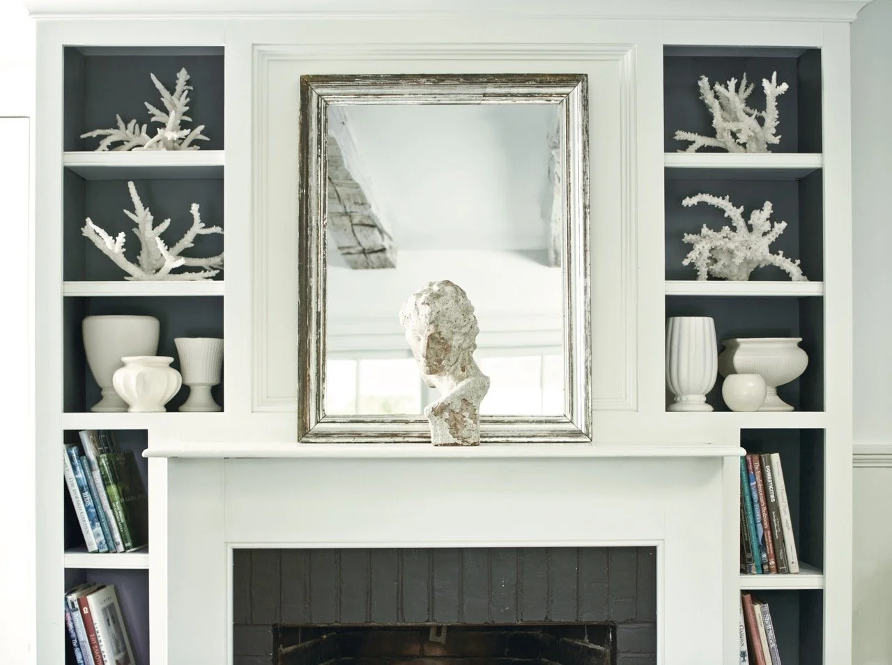 Benjamin Moore white interior paint on a fireplace mantle with white accents