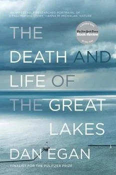 Book cover titled 'The Death and Life of the Great Lakes' by Dan Egan, featuring an image of a vast lake with a boat and a whistle in the foreground, and mountains in the background.