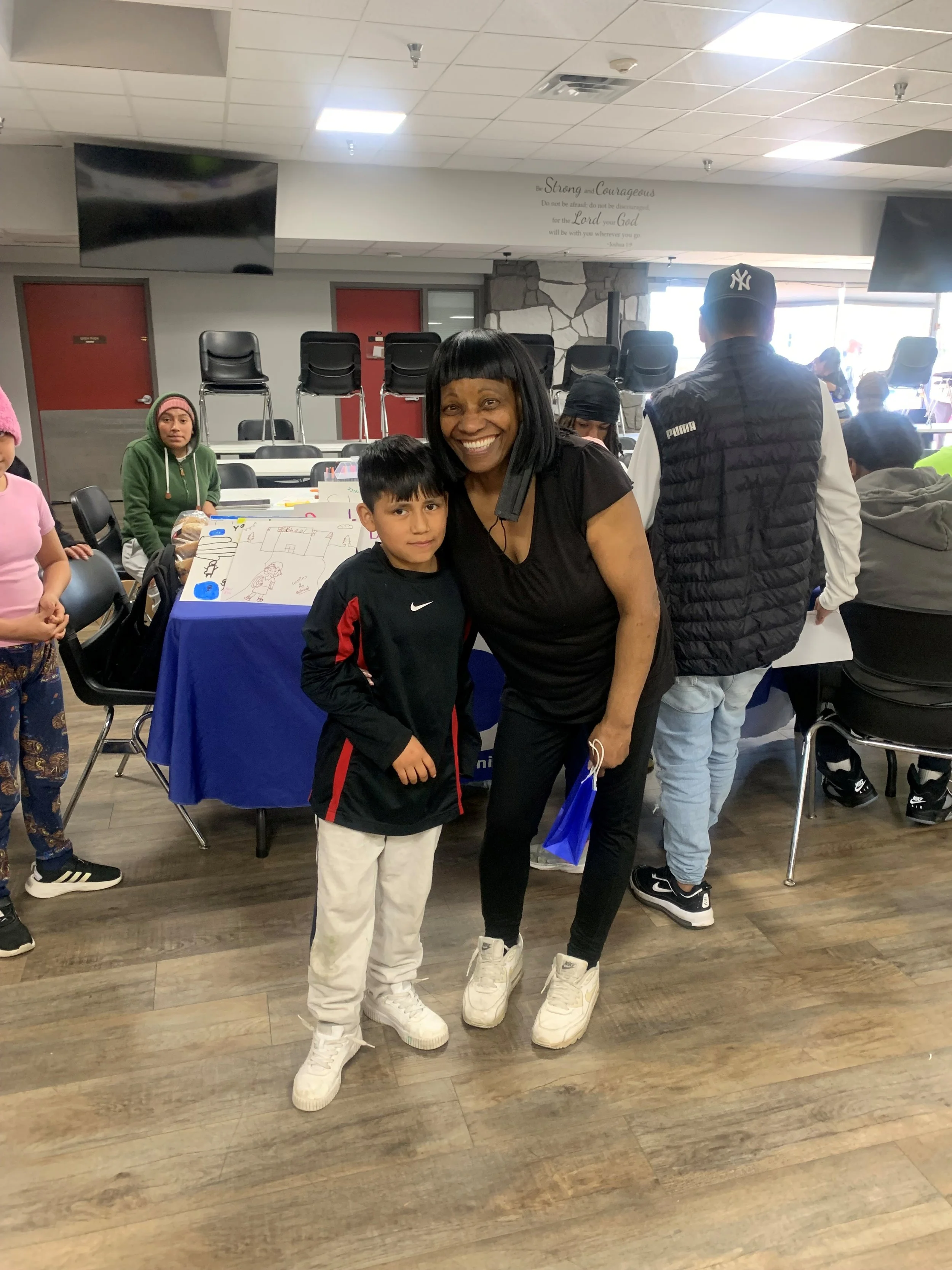 Diana poses with a youth at a health event