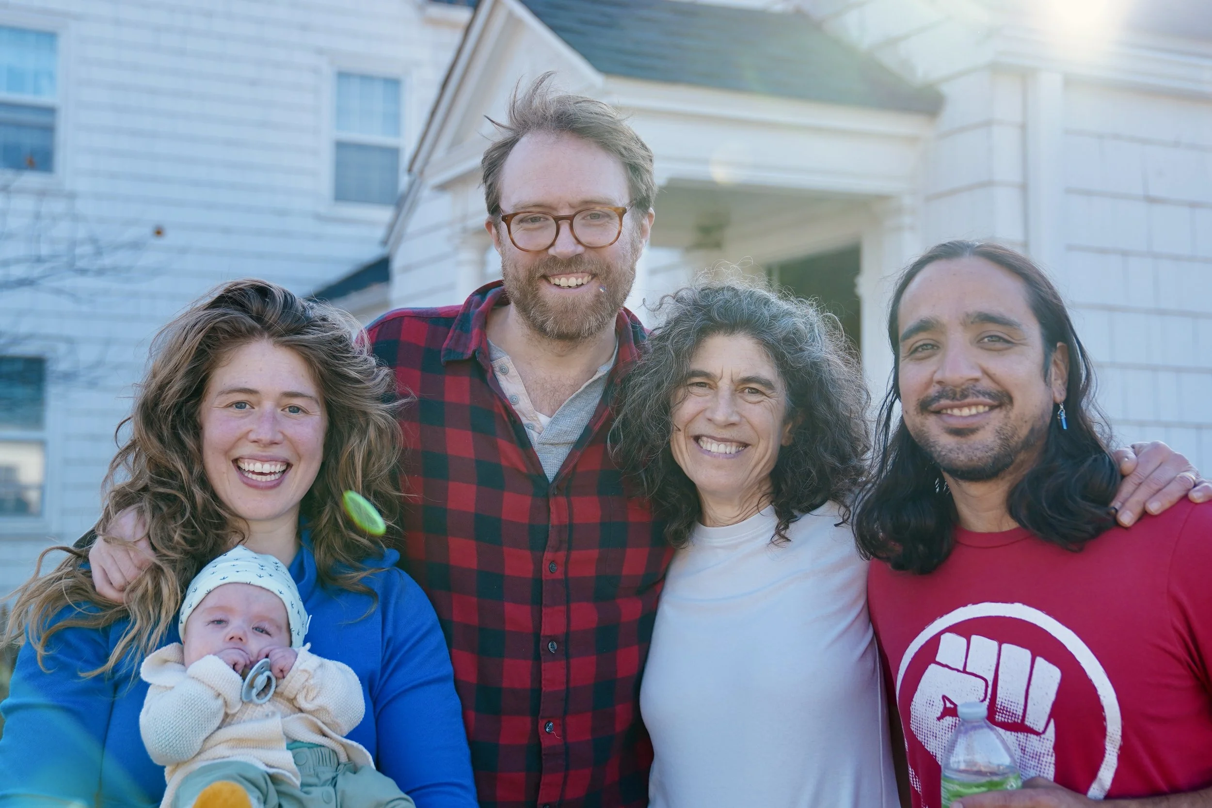 Neighbors posing together outdoors