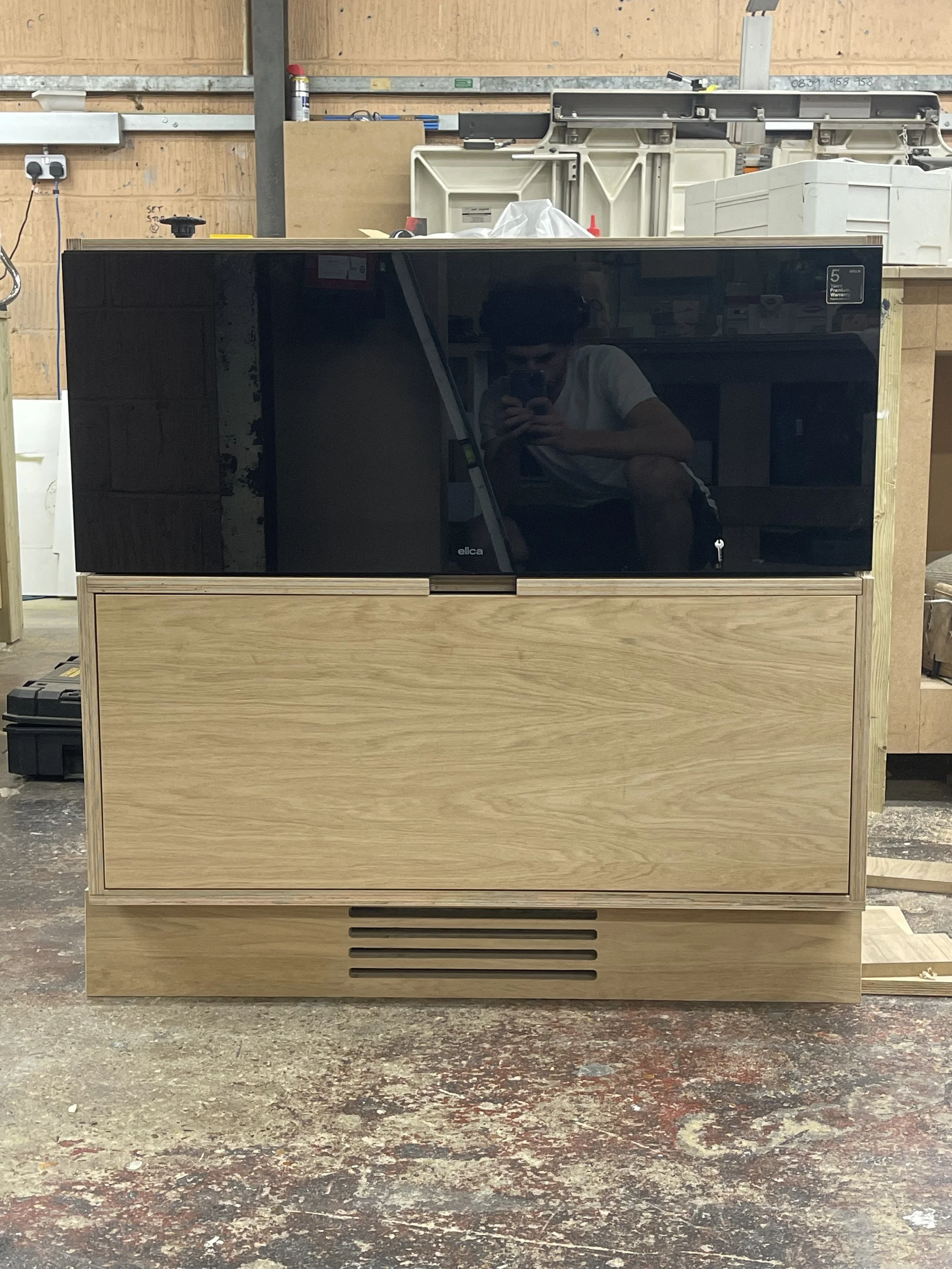 Elica Oven bespoke housing in Oak veneer birch ply. Bespoke Grille