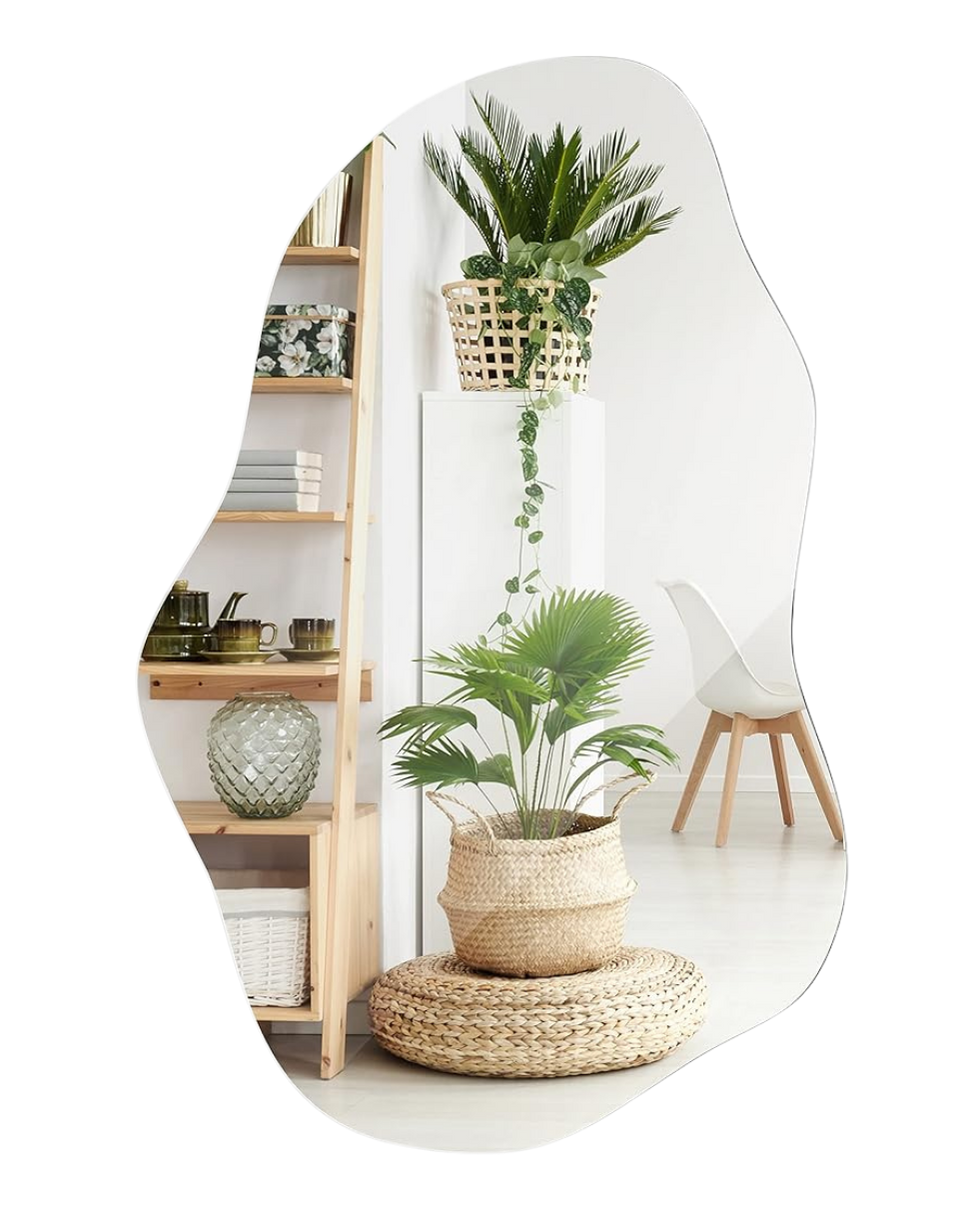 Indoor space with a large potted plant on a woven circular mat, a wooden bookshelf with ceramics and books, and a white chair with wooden legs.