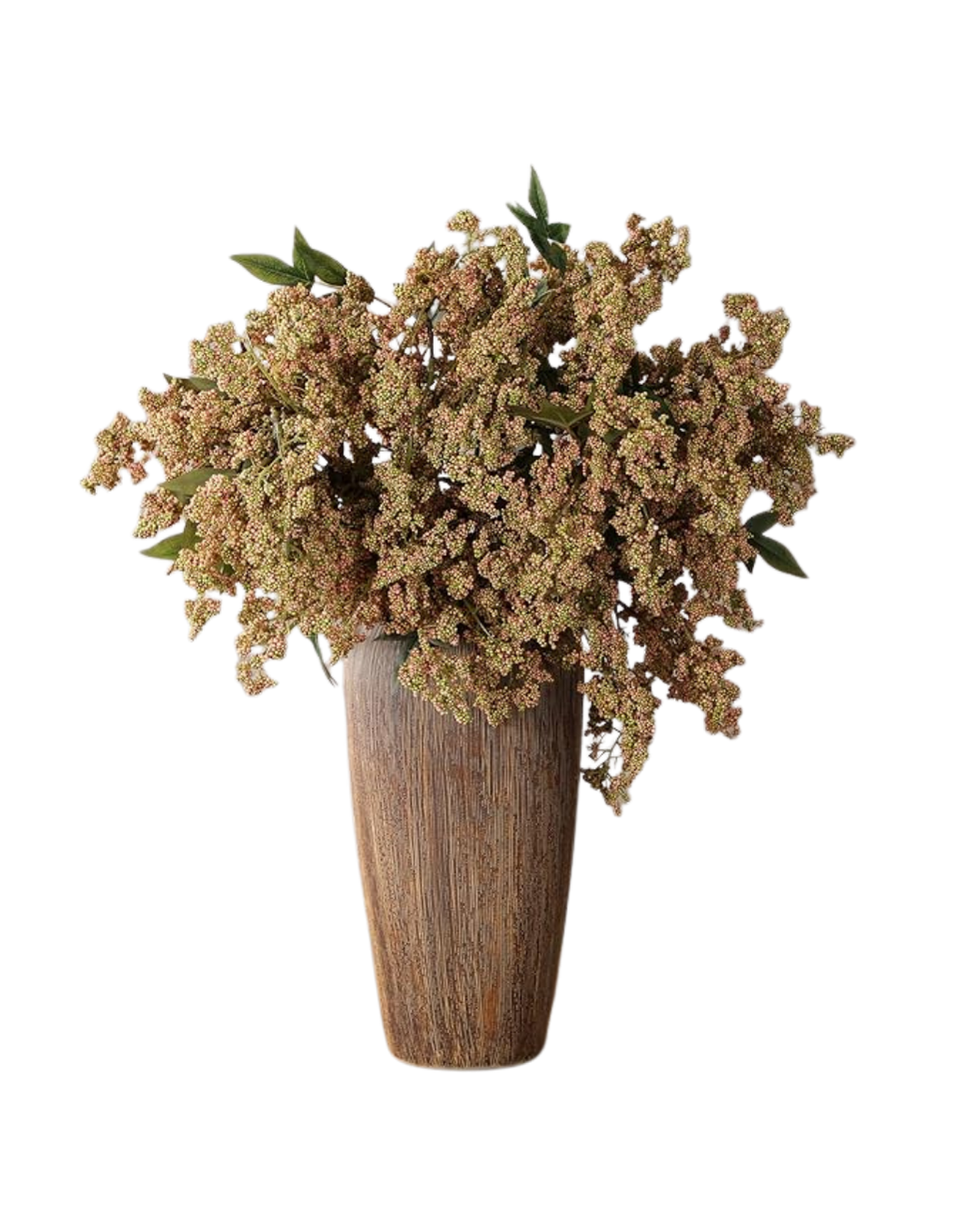 A large bouquet of dusty pink flowers with green leaves in a tall, rustic wooden vase.