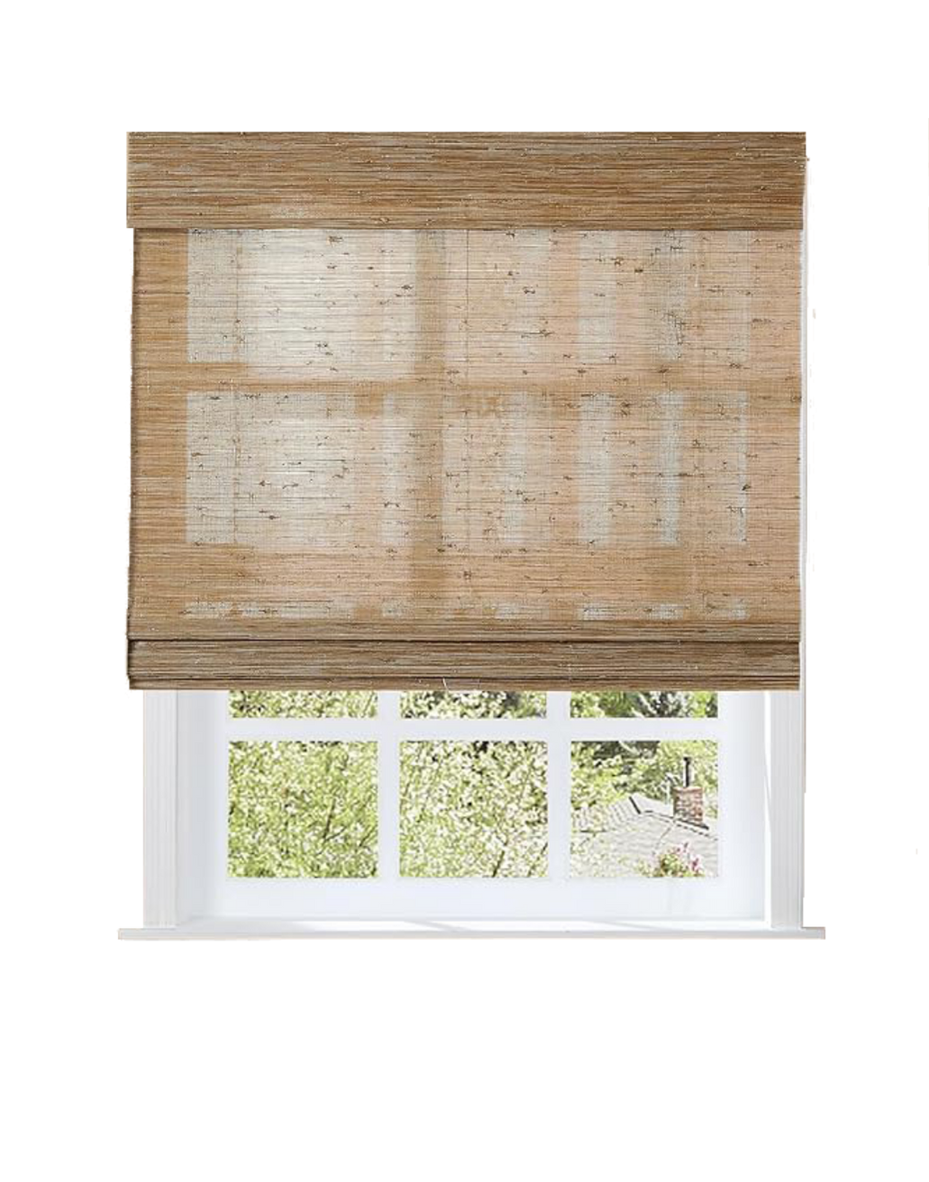 A window with a beige bamboo roll-up shade partially covering it, showing trees with green leaves and a small chimney outside.