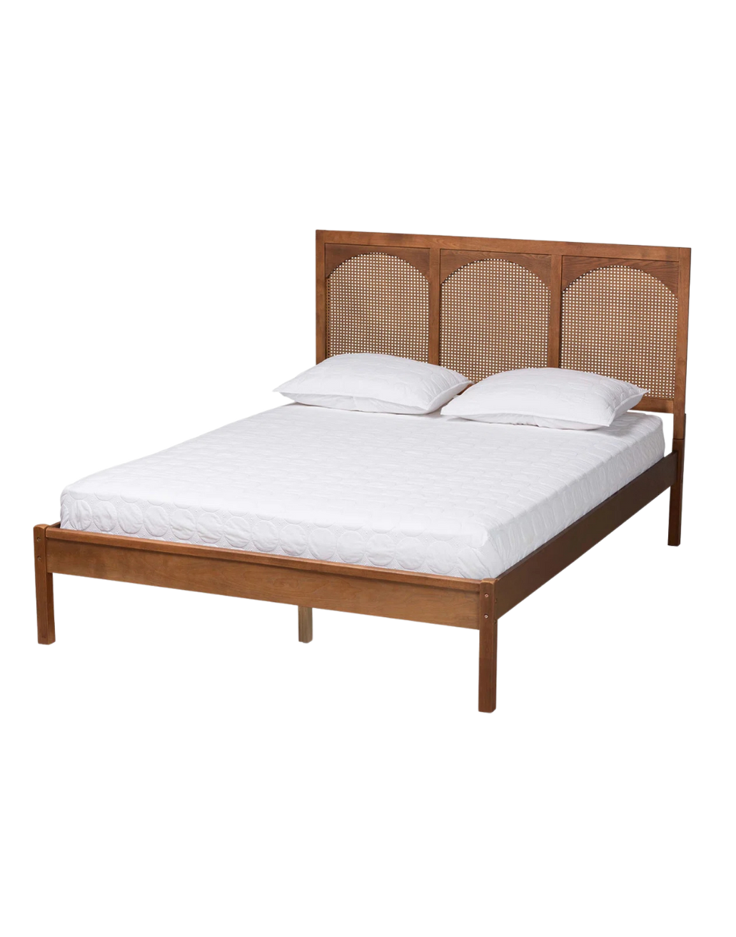 Wooden bed with white mattress, two white pillows, and a wooden headboard with a rattan pattern.