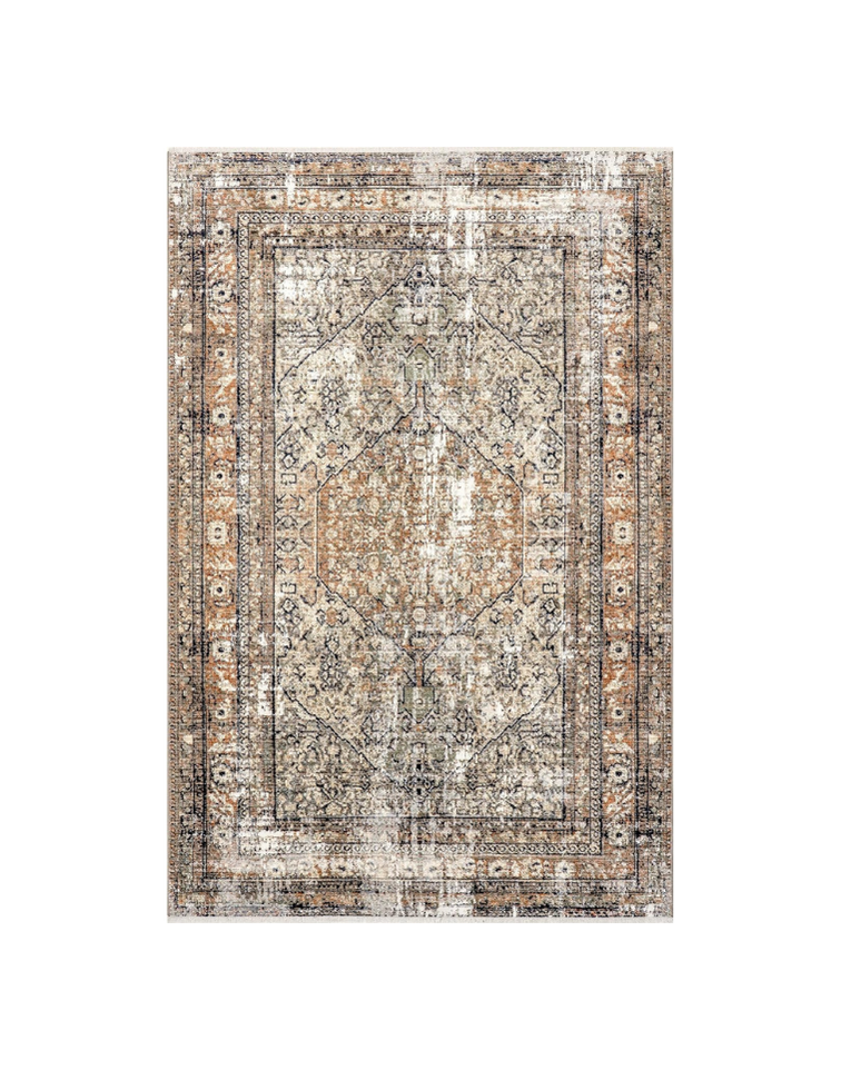 A vintage, distressed area rug with intricate floral and geometric patterns in shades of beige, brown, and black.