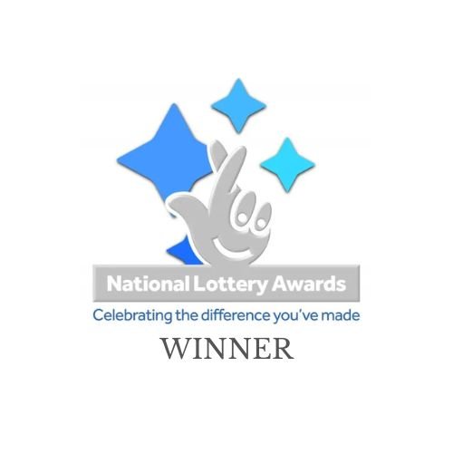 A logo for the National Lottery Awards featuring a smiling hand with a thumbs-up gesture and four blue stars. Below is the text "Celebrating the difference you’ve made" and the word "WINNER".