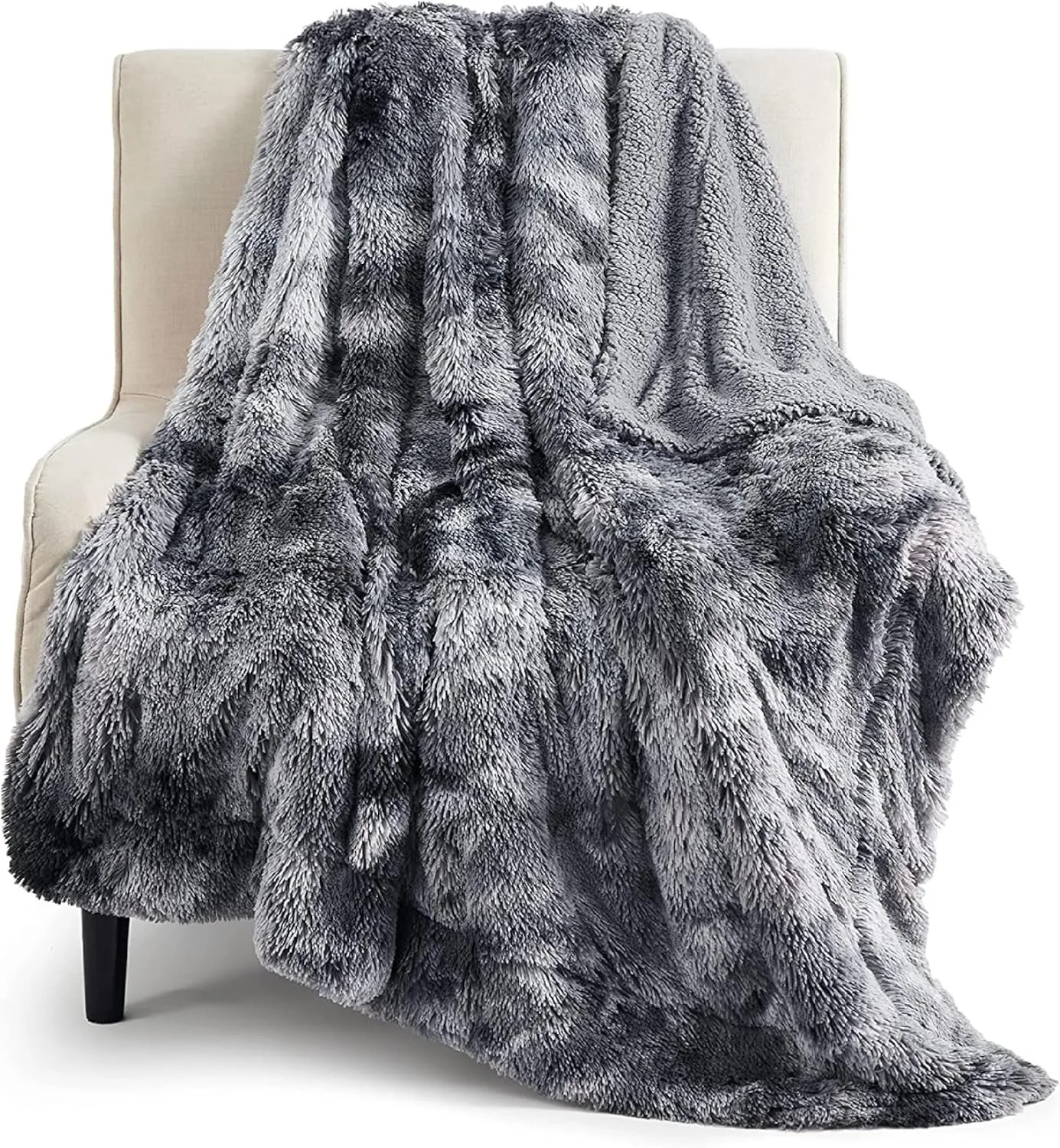 Gray faux fur throw on an arm chair