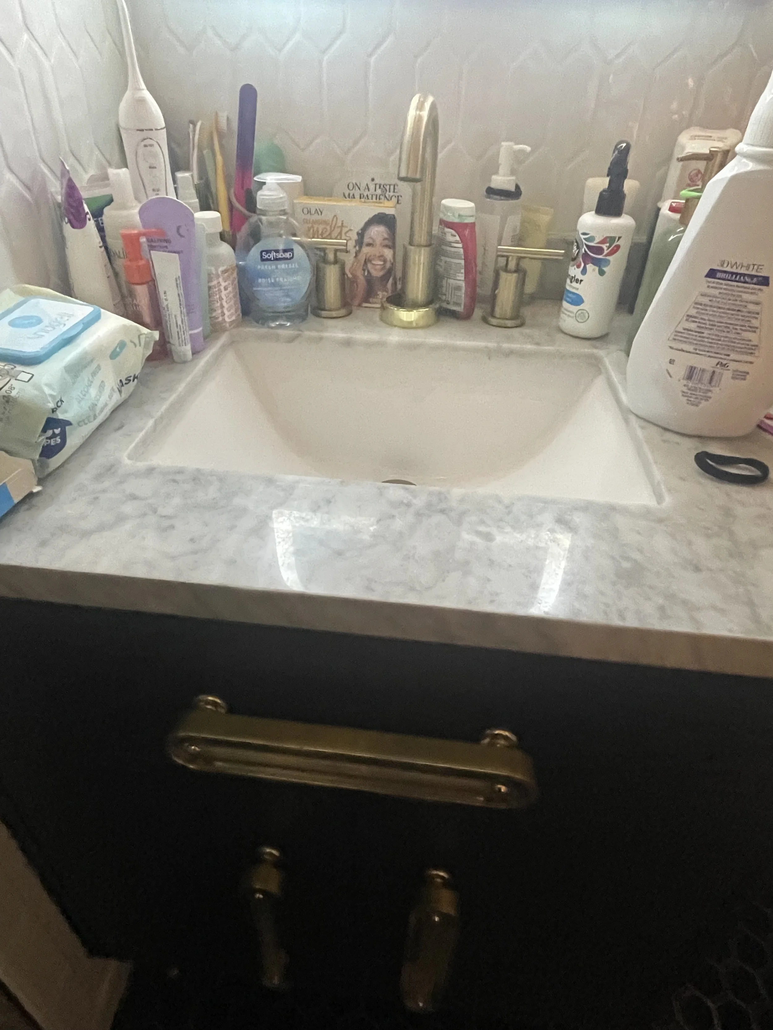 Before: A cluttered bathroom counter mess