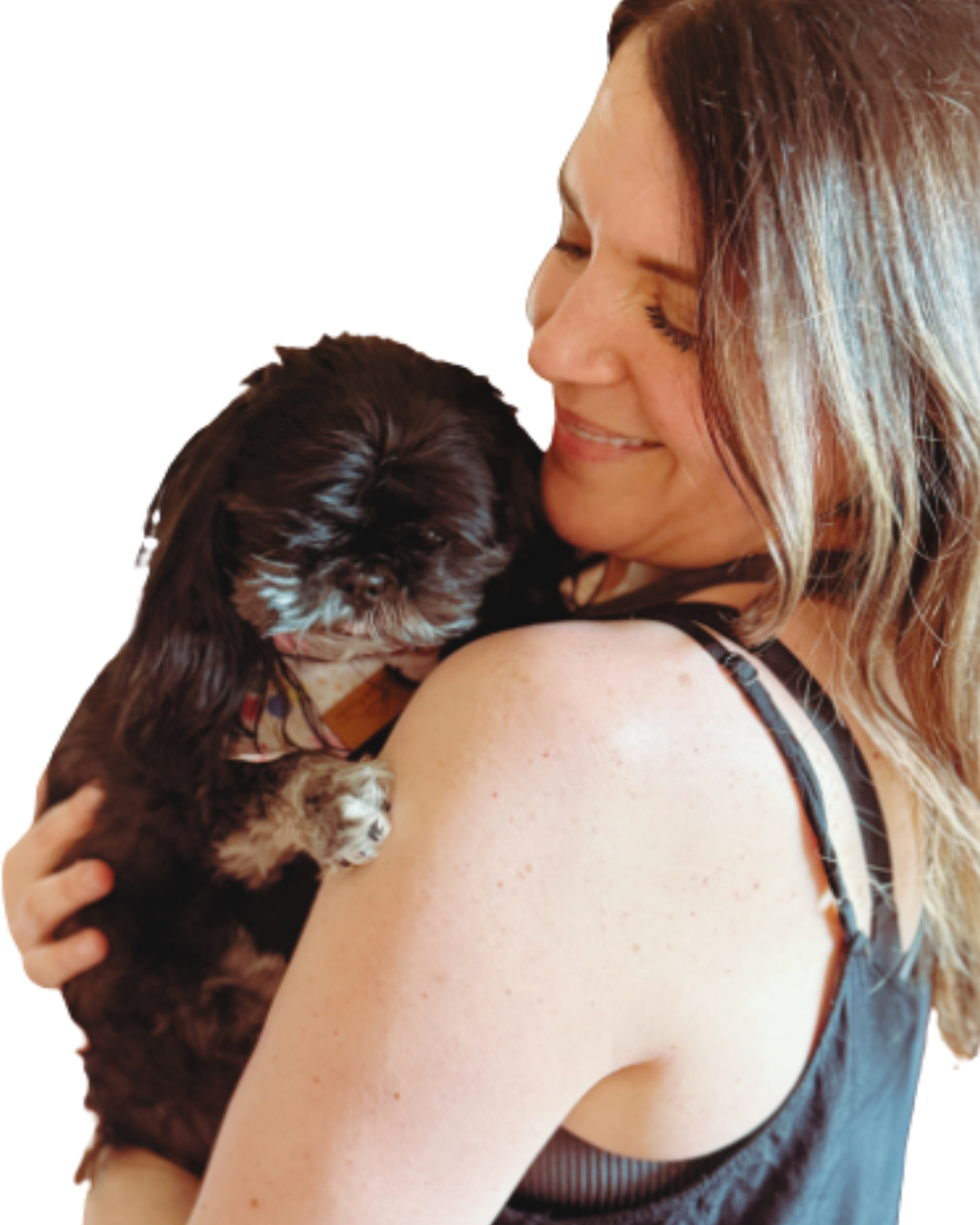 Mel Rolfes smiling while holding her dog