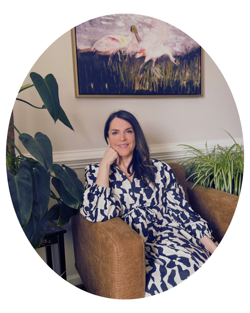 image of Mel Rolfes sittingin grounding, inviting space in professional attire