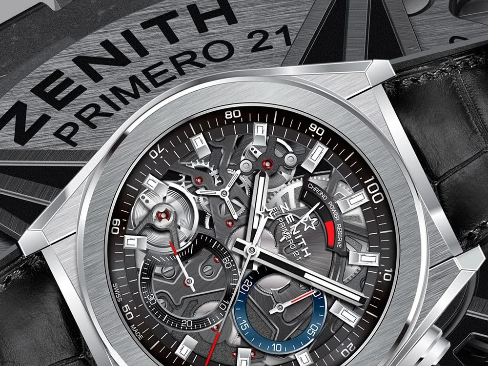 Close-up of a Zenith El Primero watch with a skeleton dial, showing gears and chronograph features, placed on a Zenith box.